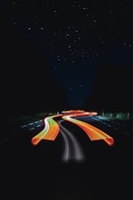 black and orange road during night time