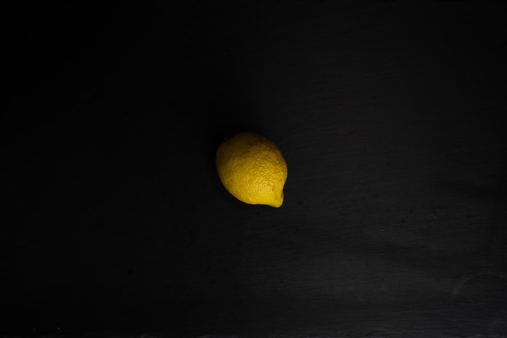 yellow lemon on black textile