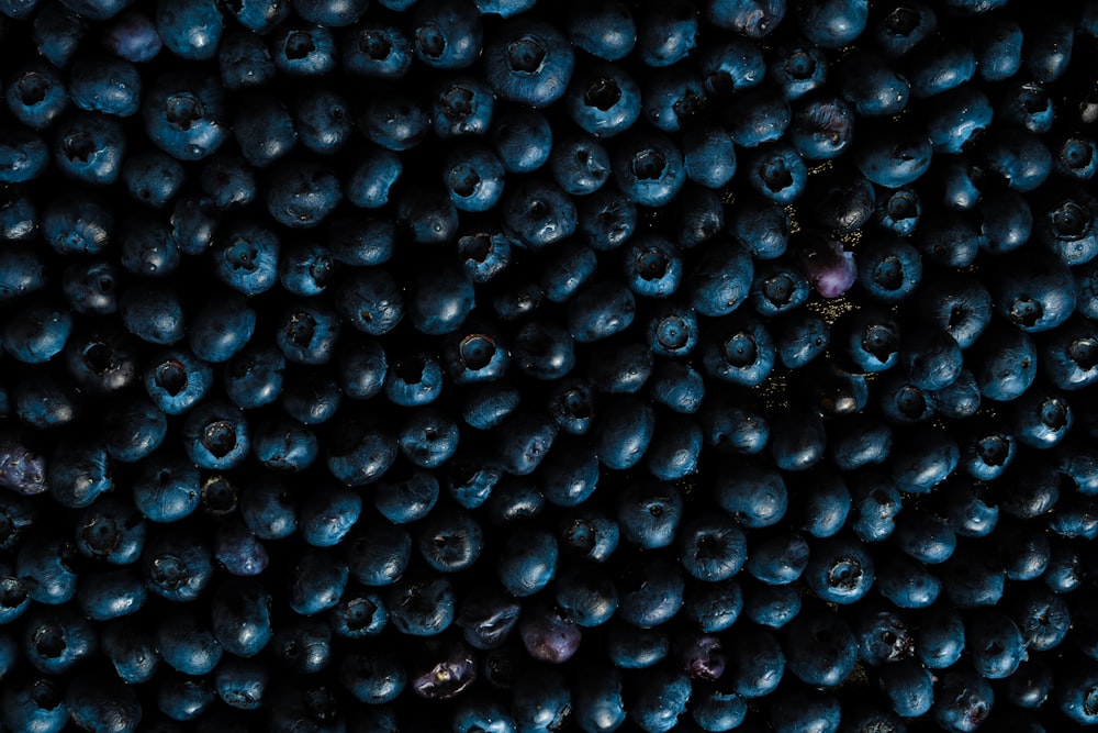 black round fruits on white surface