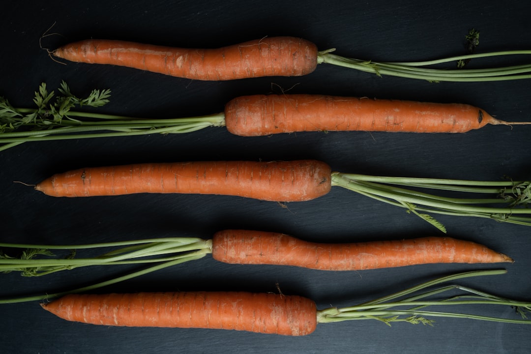 3 carrots on black textile