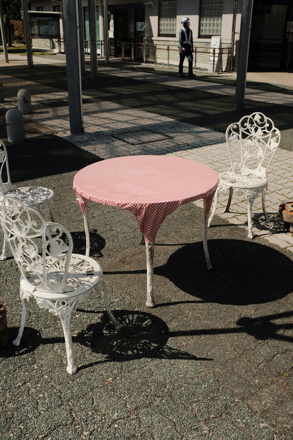 red round table with white chairs