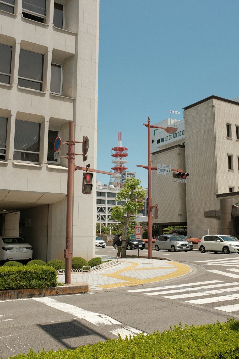 cars parked in front of brown building during daytime