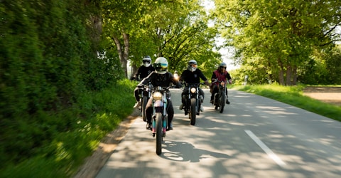 Group of motorcyclists riding together on a scenic Pennsylvania road near Carlisle.