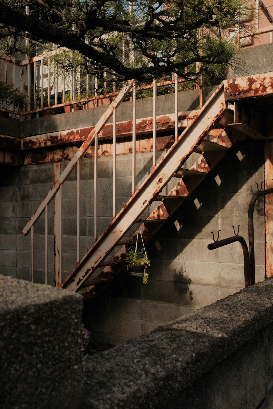 gray concrete staircase with stainless steel railings