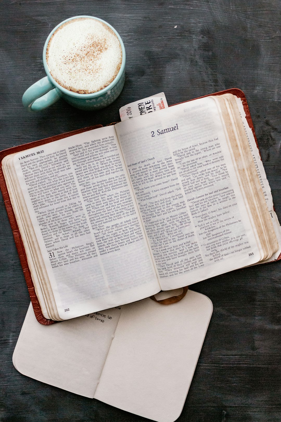 white book page on black wooden table