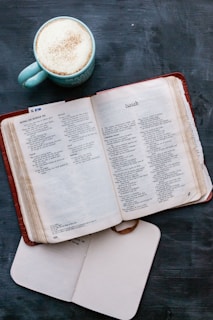 white book page on brown wooden table