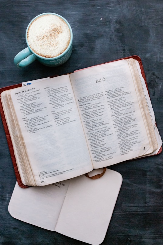 white book page on brown wooden table
