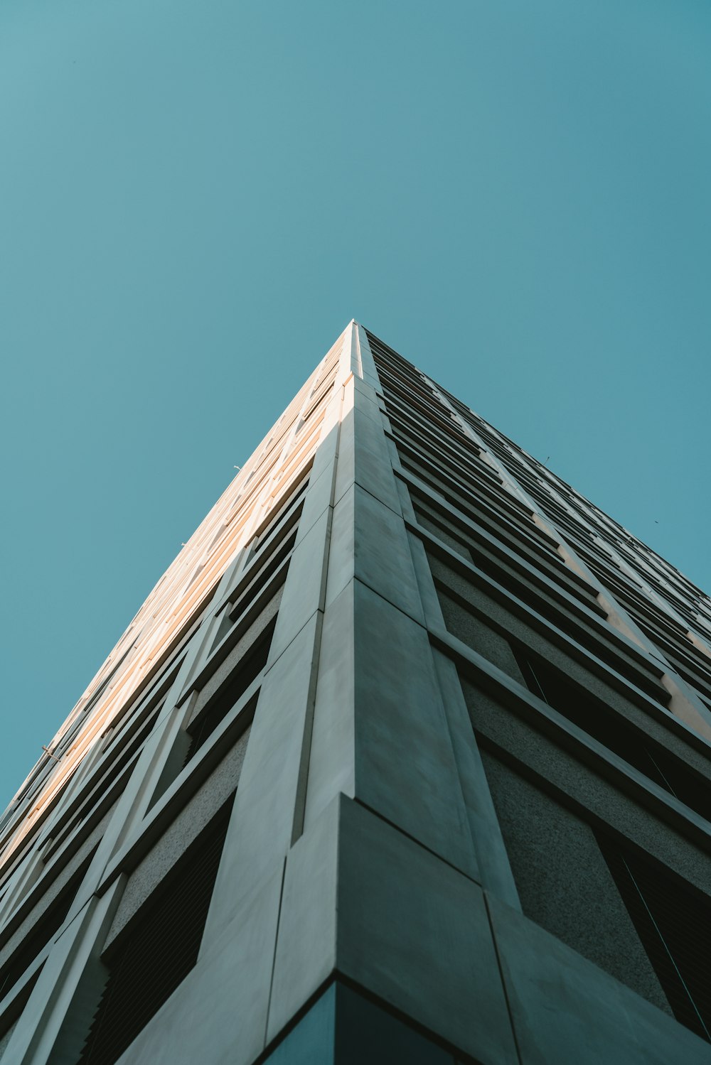 brown concrete building under blue sky during daytime