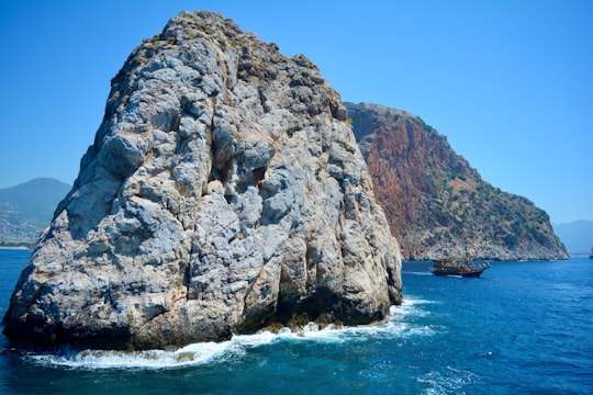 gray rock formation on sea during daytime in Alanya Turkey
