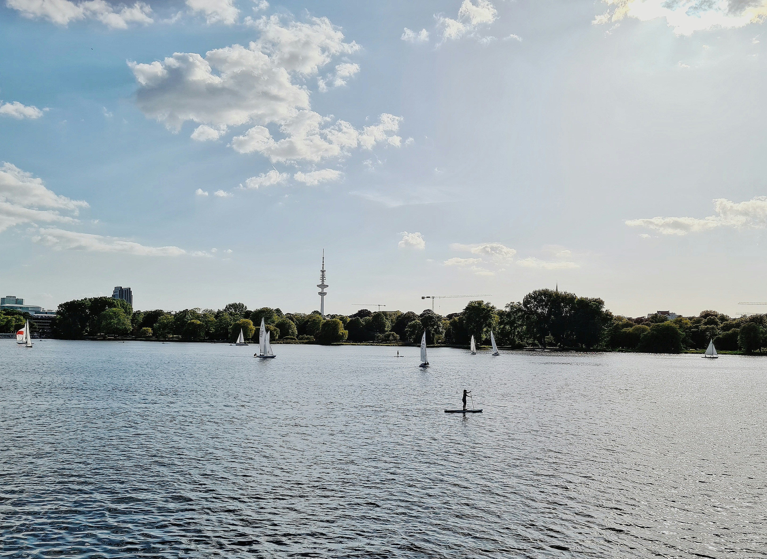 people on lake during daytime