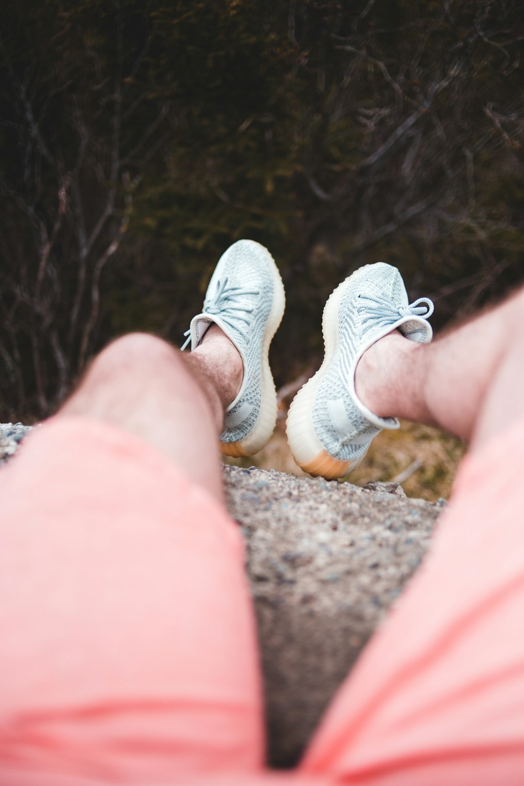 person wearing gray and white sneakers