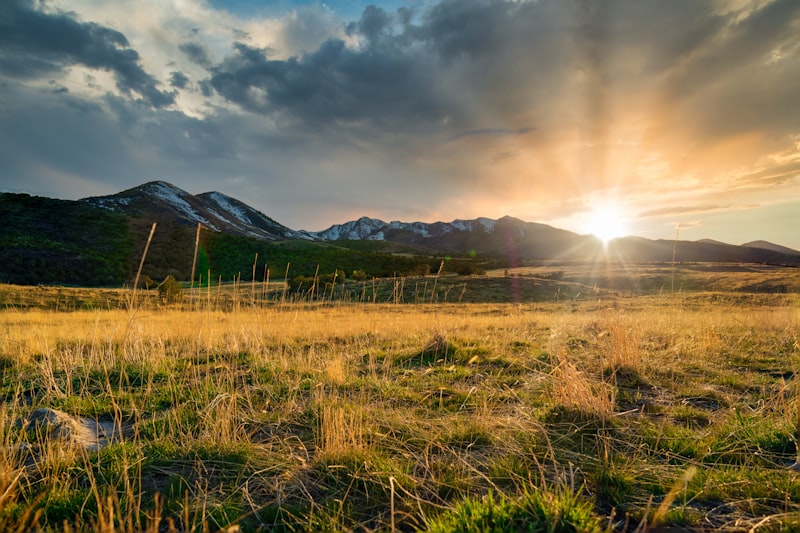 Green field with mountain views in Southern Utah