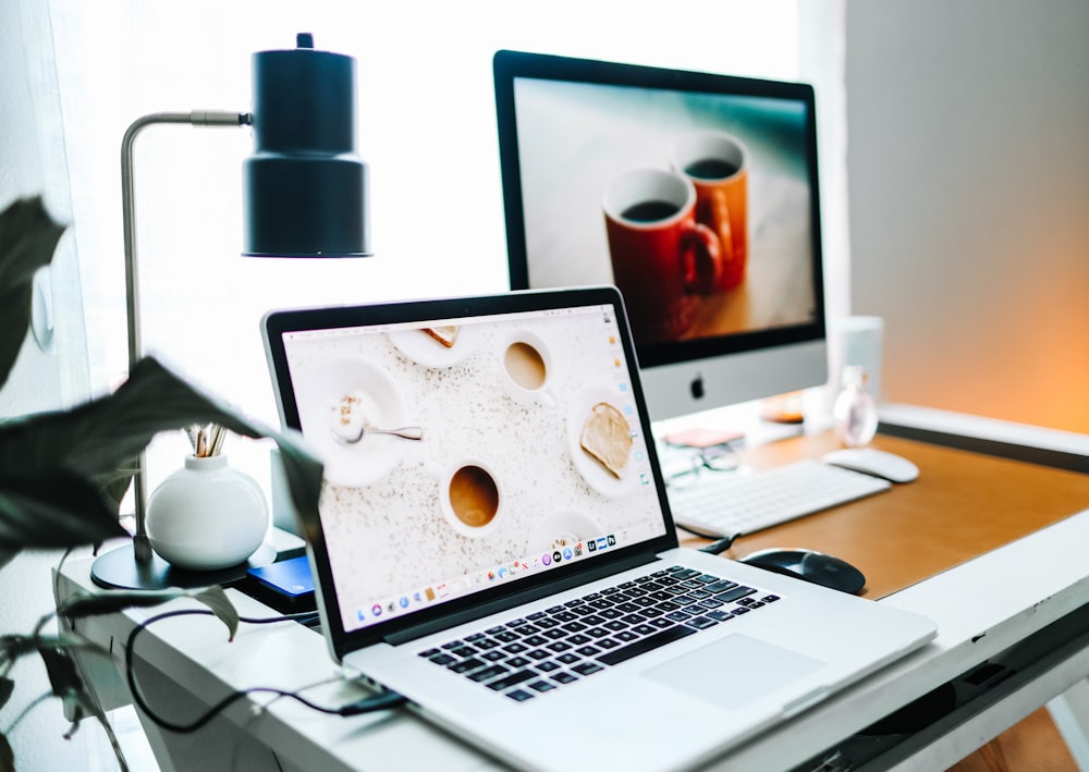 macbook pro on white table