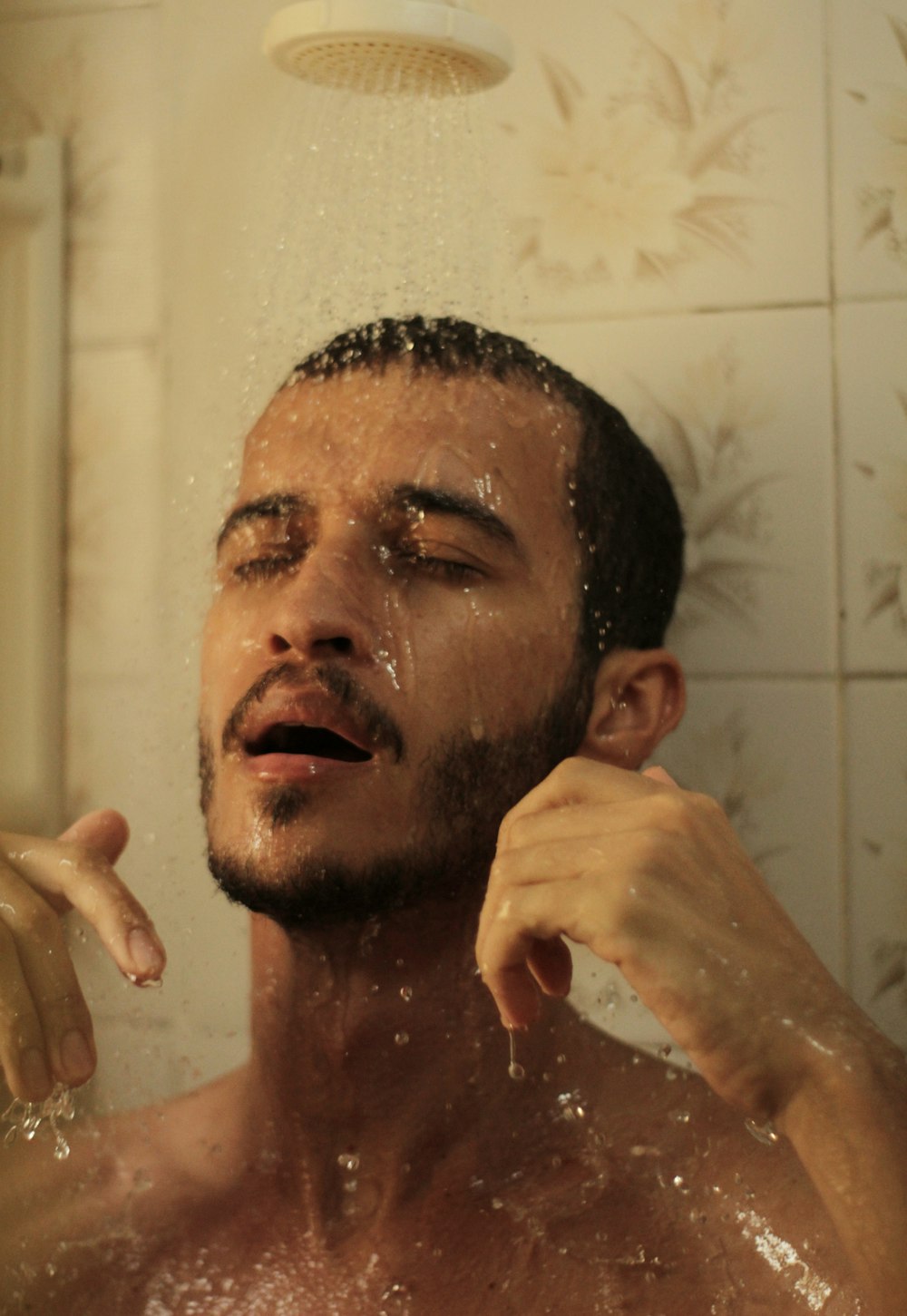 man in bathtub with water