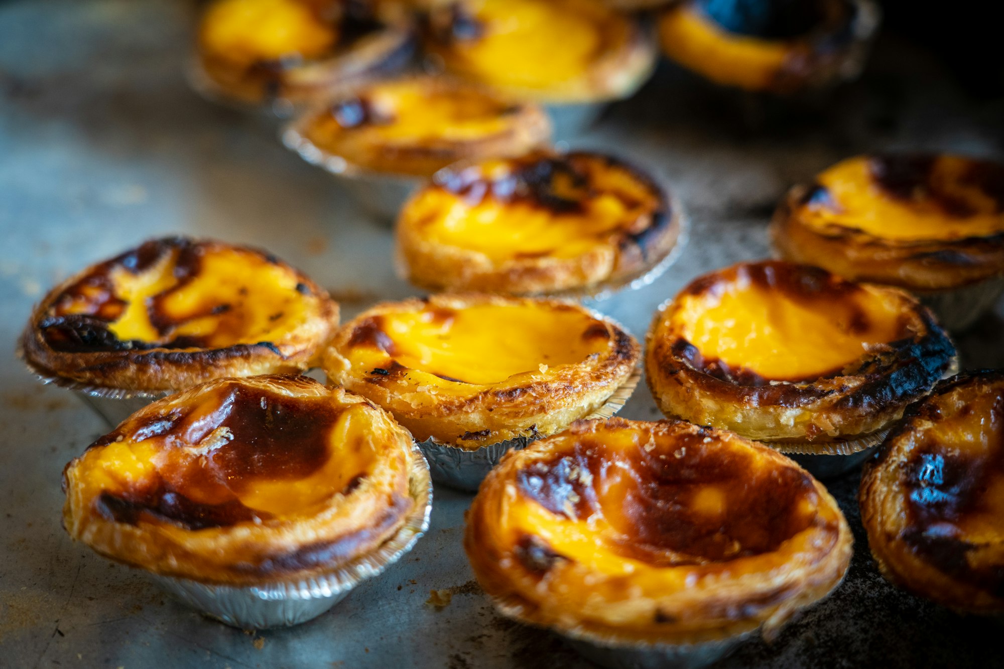 Pastel De Nata is a Portuguese egg tart pastry, dusted with cinnamon.  Our local tapas restaurant bakes them on a daily basis and they are a real treat.