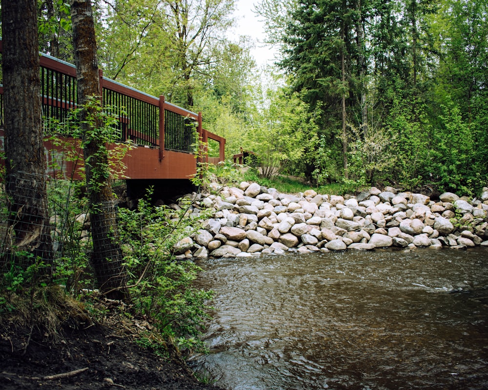 brown wooden bridge over river