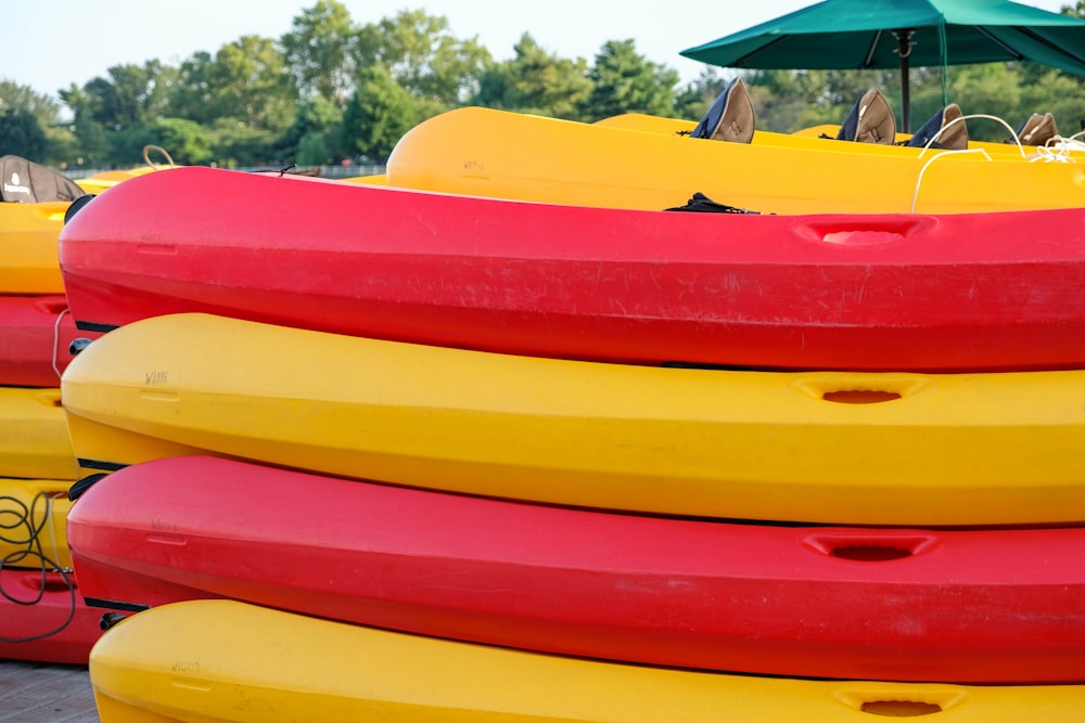 yellow red and blue kayak lot
