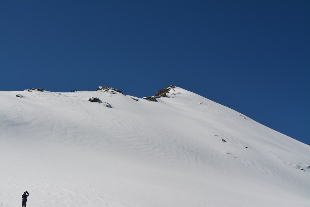 snow covered mountain under blue sky during daytime