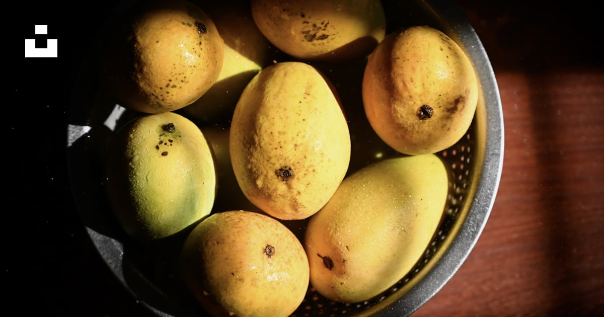 Fruits ronds jaunes sur bol rond noir photo – Photo Plante Gratuite sur ...