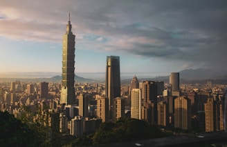 city skyline under gray cloudy sky during daytime