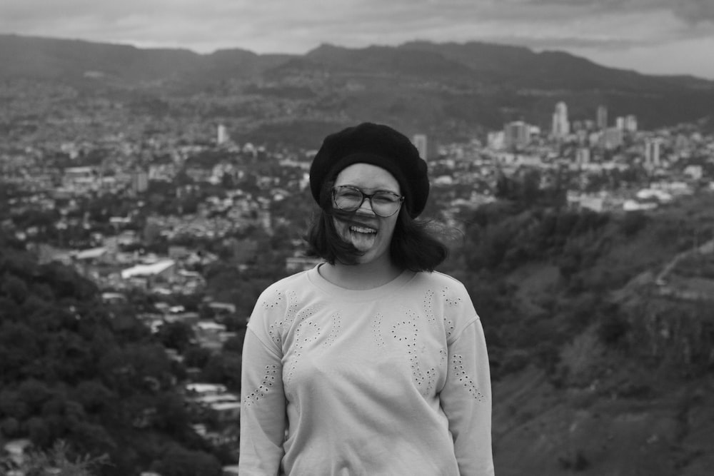 grayscale photo of woman in crew neck long sleeve shirt and black knit cap