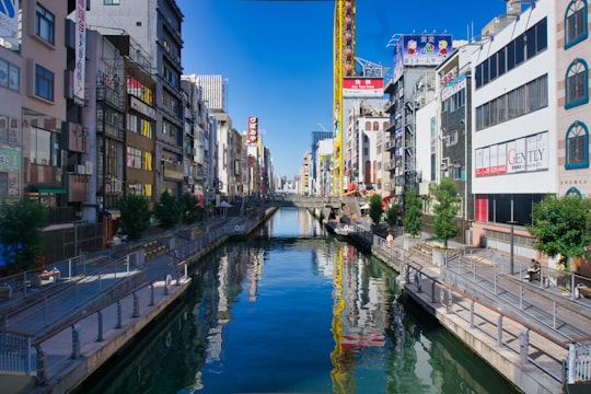 river between buildings during daytime in Shinsaibashi Shopping Arcade Japan
