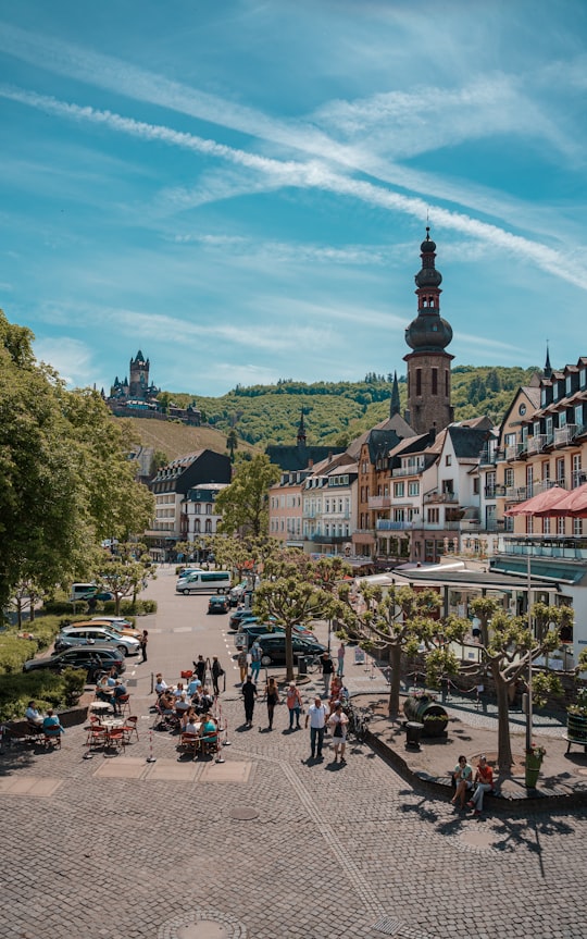 people walking on street near buildings during daytime in Cochem Germany