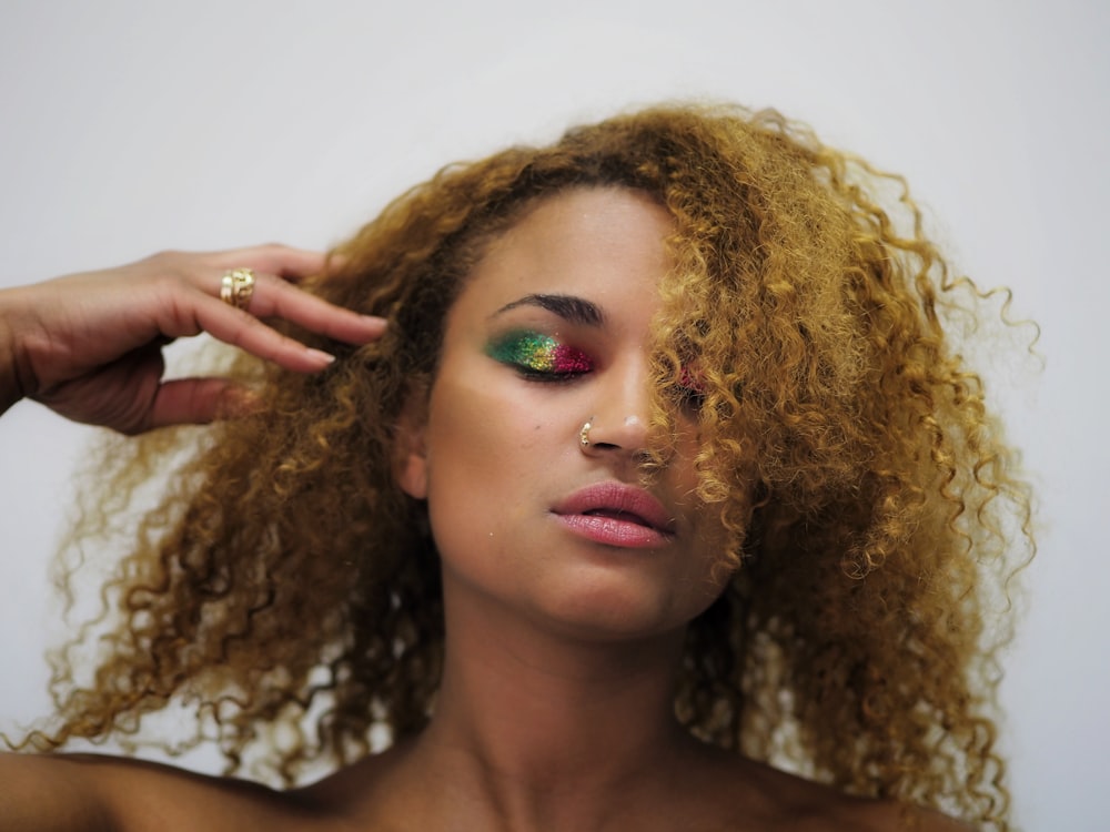 woman with green lipstick and blonde hair