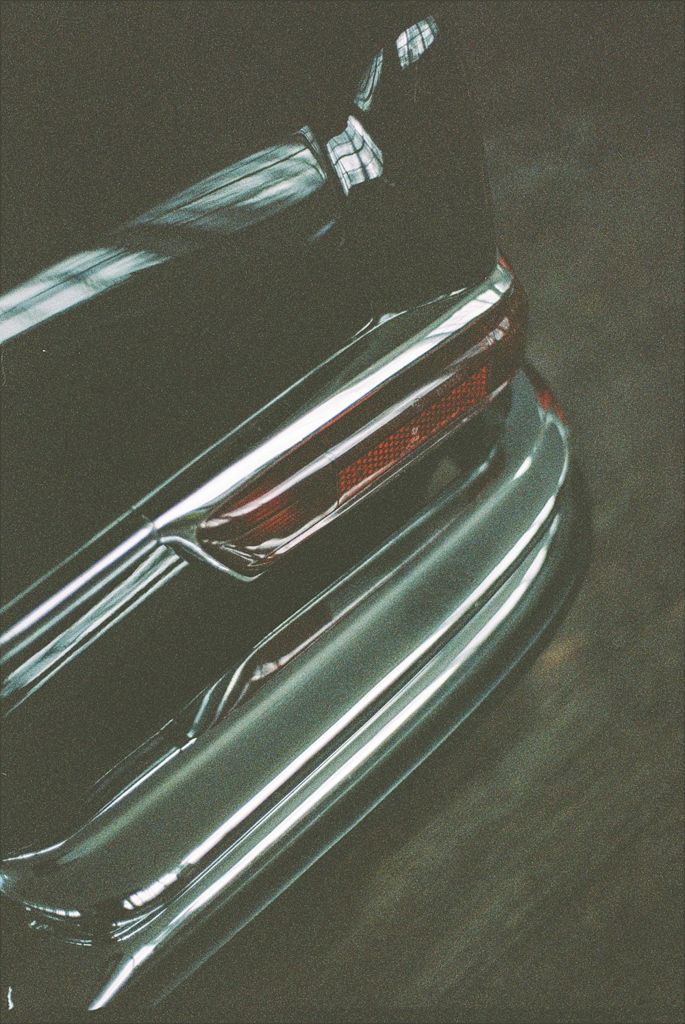 black and red car in a dark room