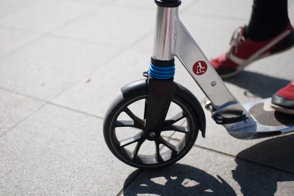 red and black bicycle on gray concrete floor