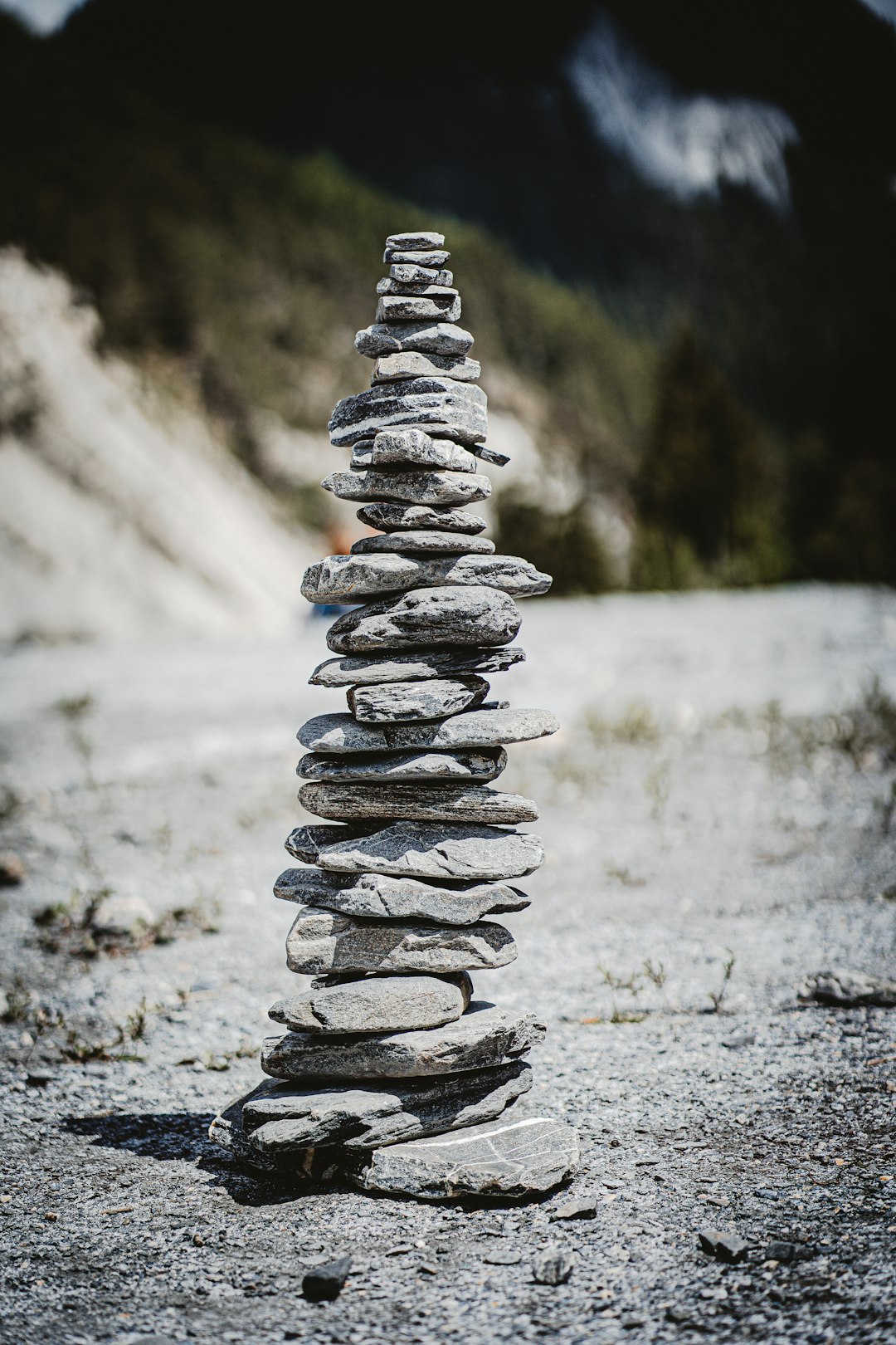 gray stone stack on gray dirt road