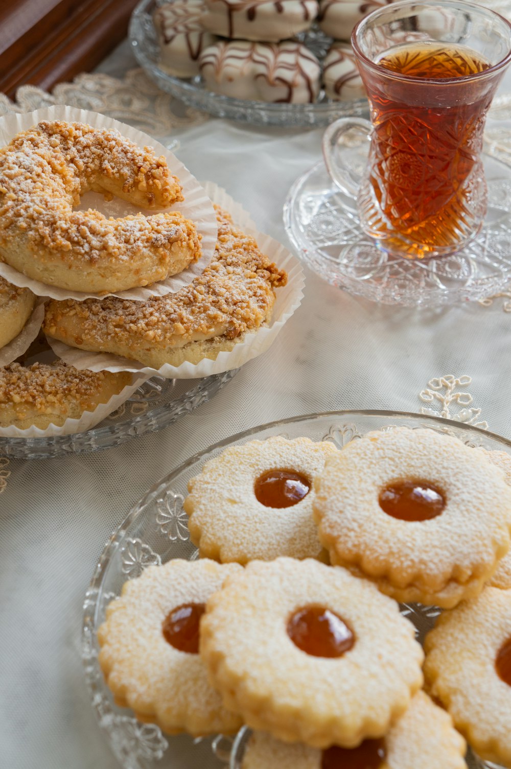 white and brown donuts on clear glass plate