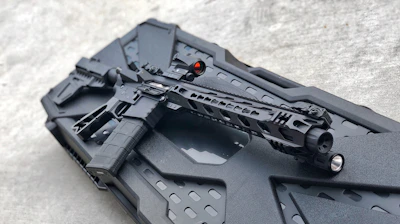 black rifle on black plastic case