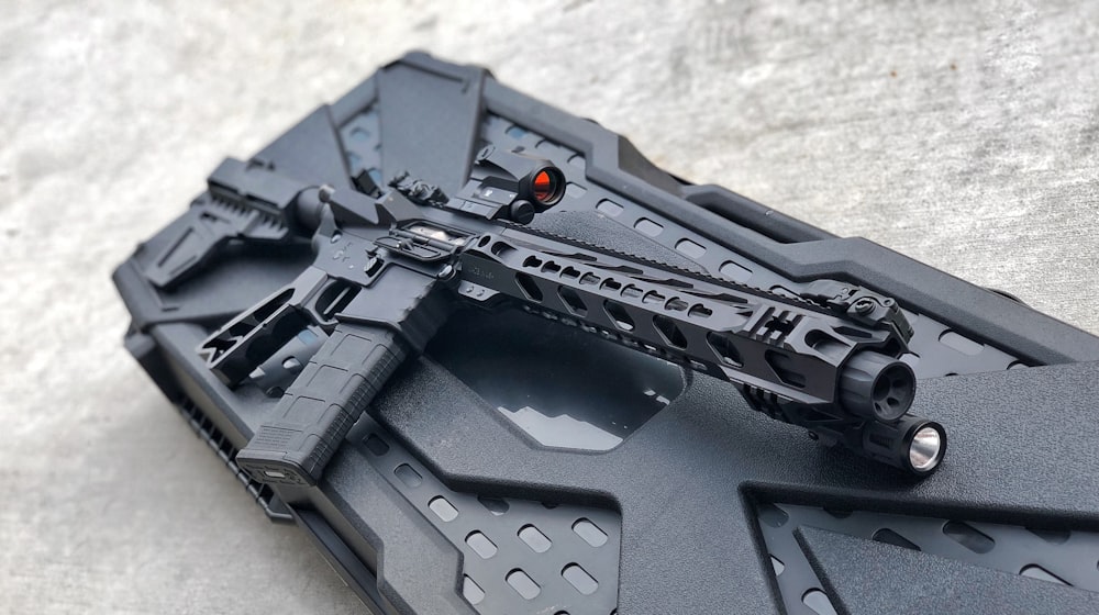 black rifle on black plastic case