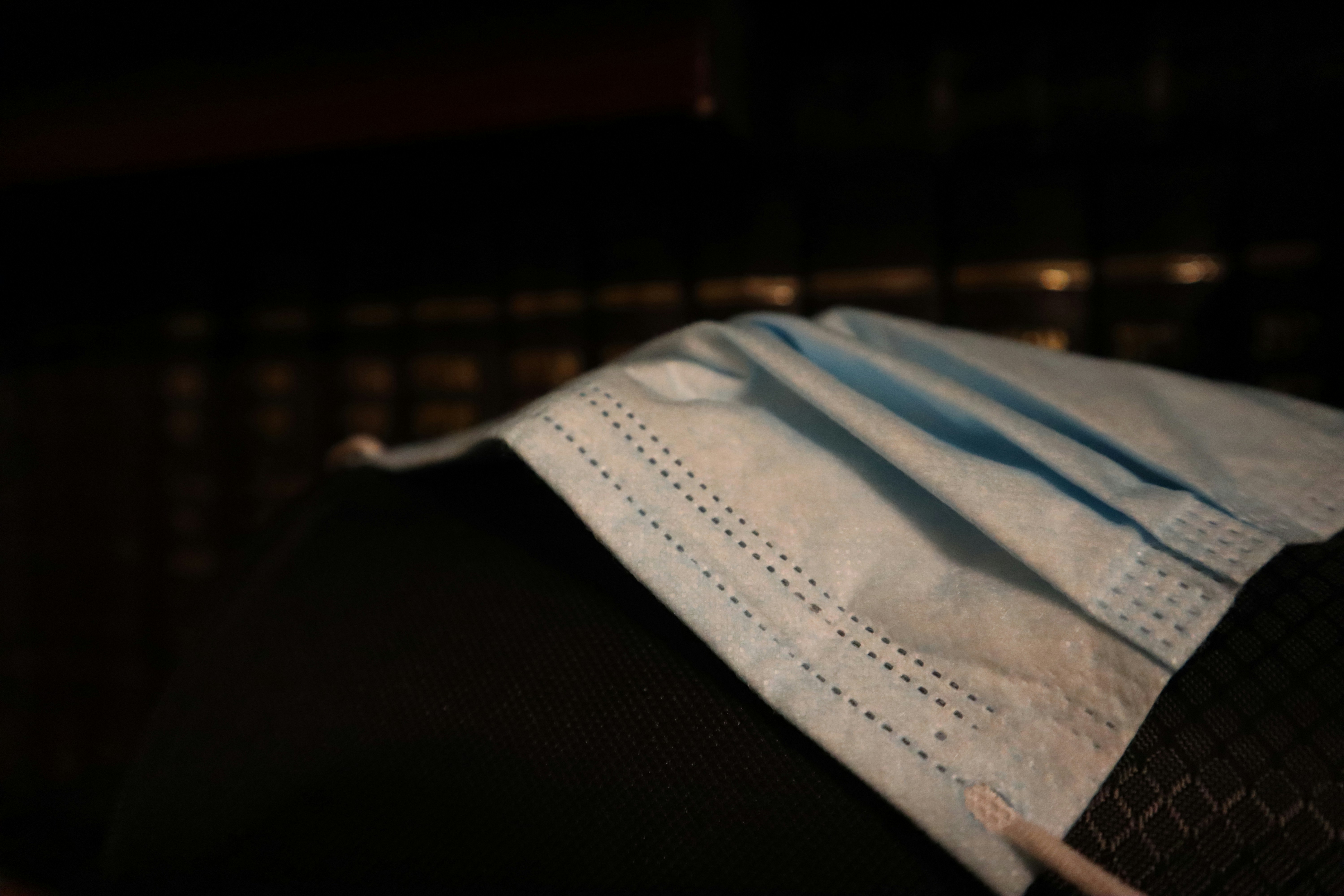 blue and white textile on black textile