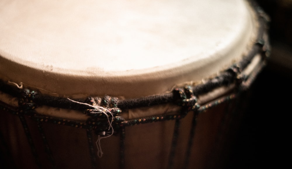 brown and white drum with white powder