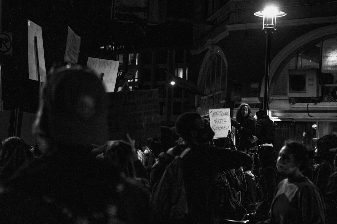 grayscale photo of people in street