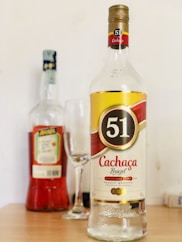 clear glass bottle with red liquid