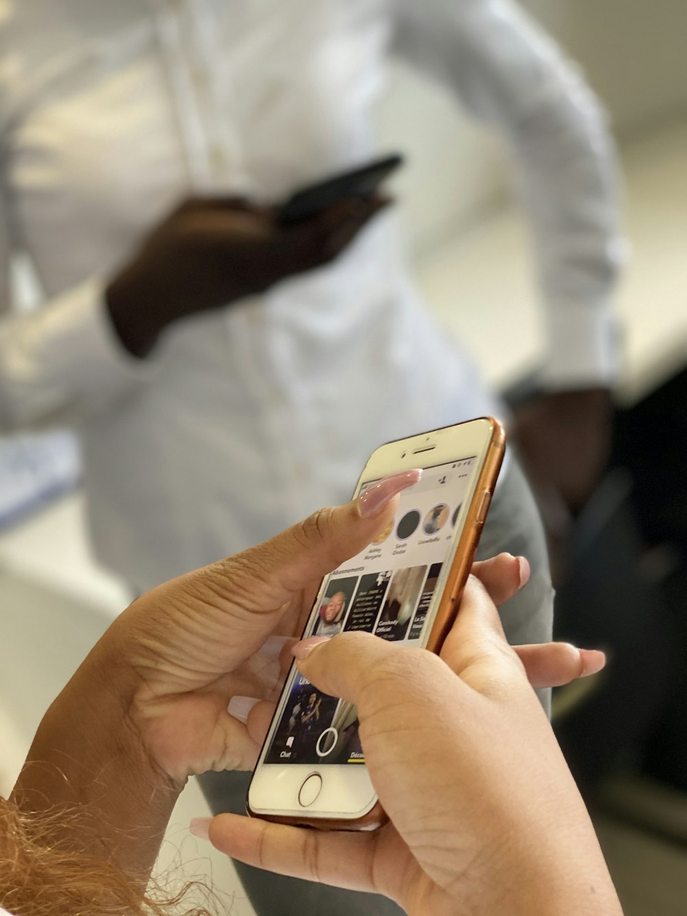 person holding white iphone 5 c