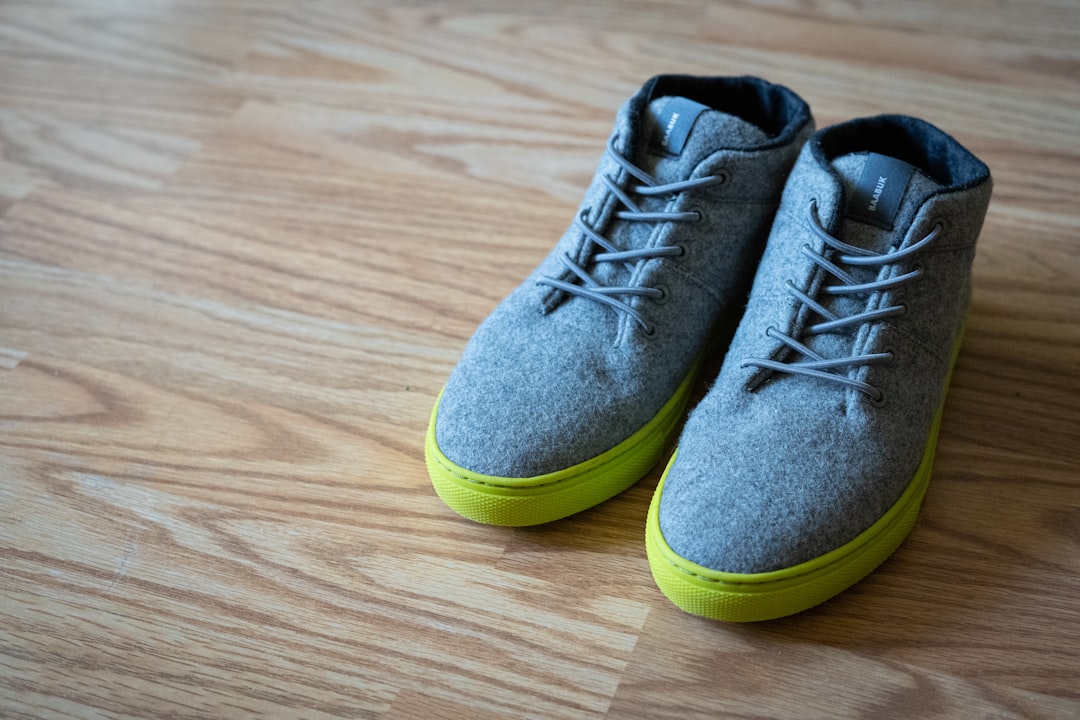 gray and yellow low top sneakers