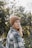 woman in brown knit cap and plaid shirt