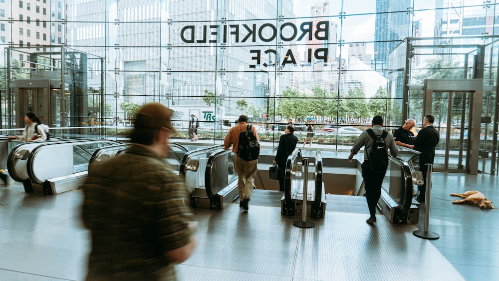 people walking on white floor tiles during daytime