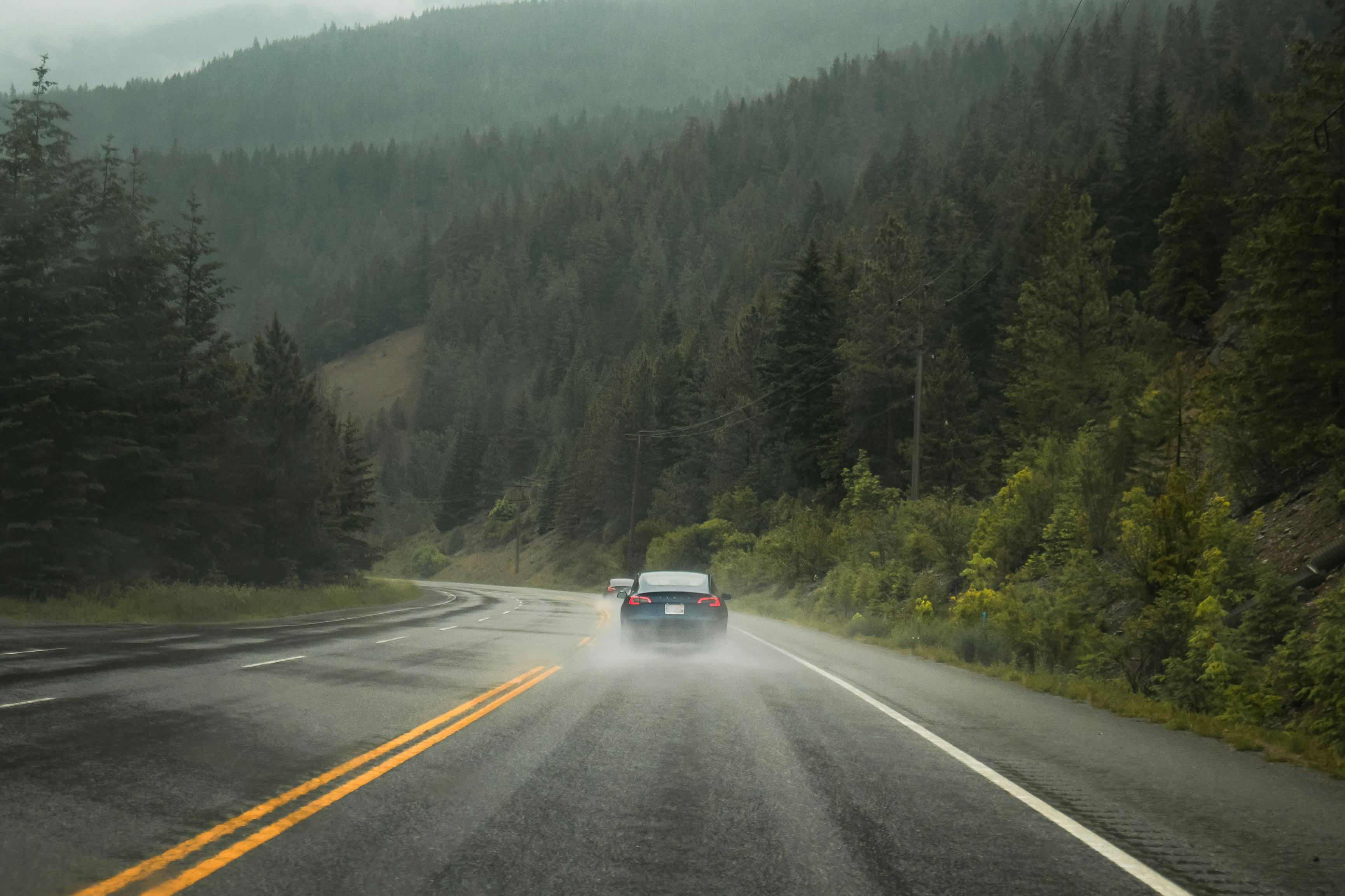 black car on road during daytime