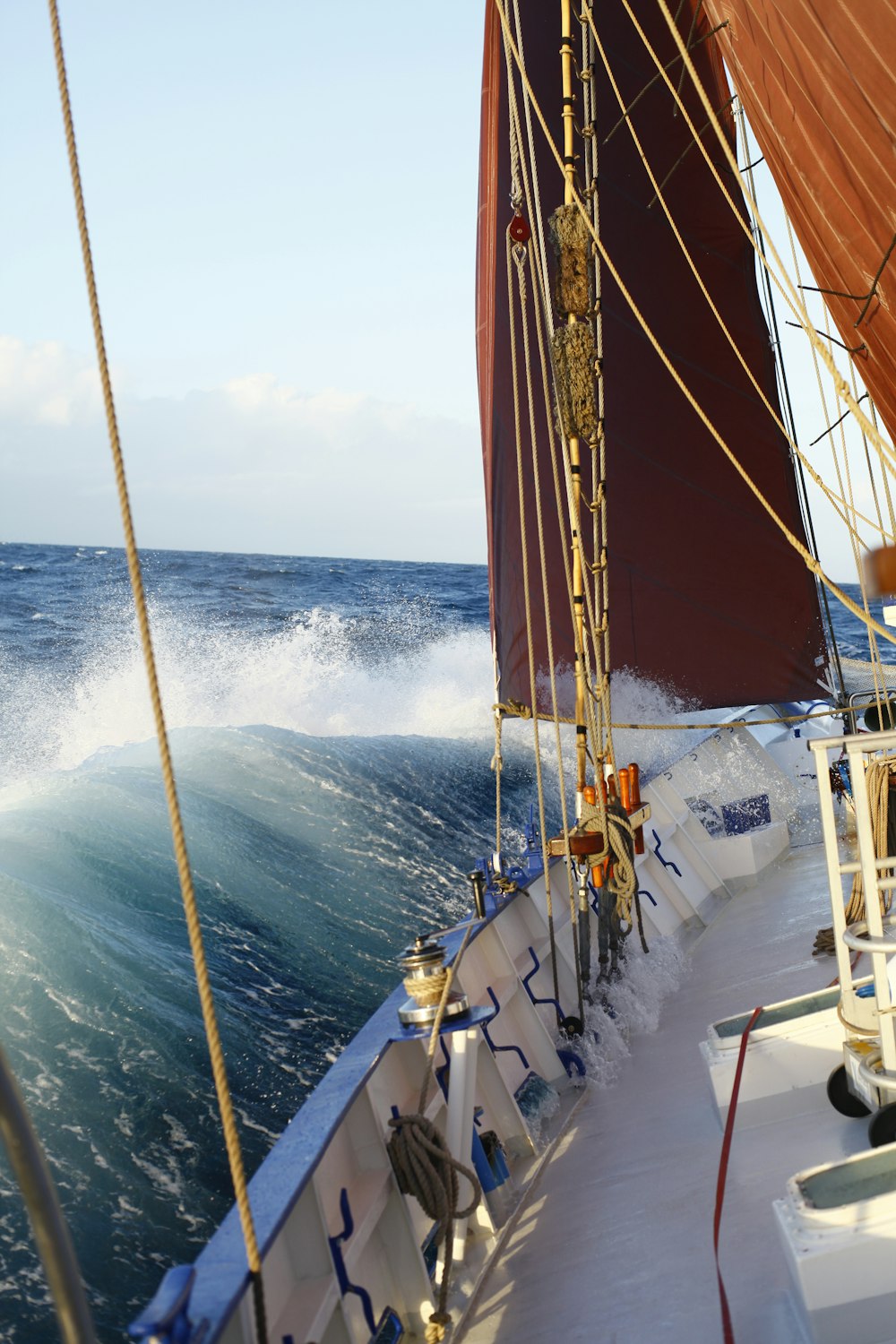 white and brown sail boat on sea during daytime