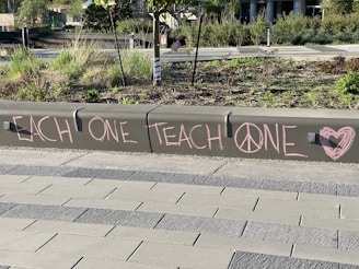 white love is love print on white brick floor