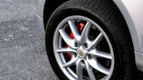 Close-up of brake pads being replaced on a vehicle wheel.