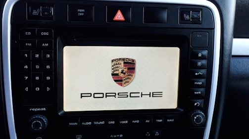 Close-up of Porsche 911 dashboard showing speed and navigation.