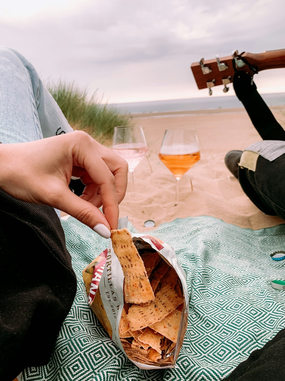 person holding bread with cheese