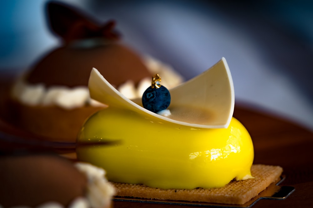 yellow and brown cake on brown wooden table