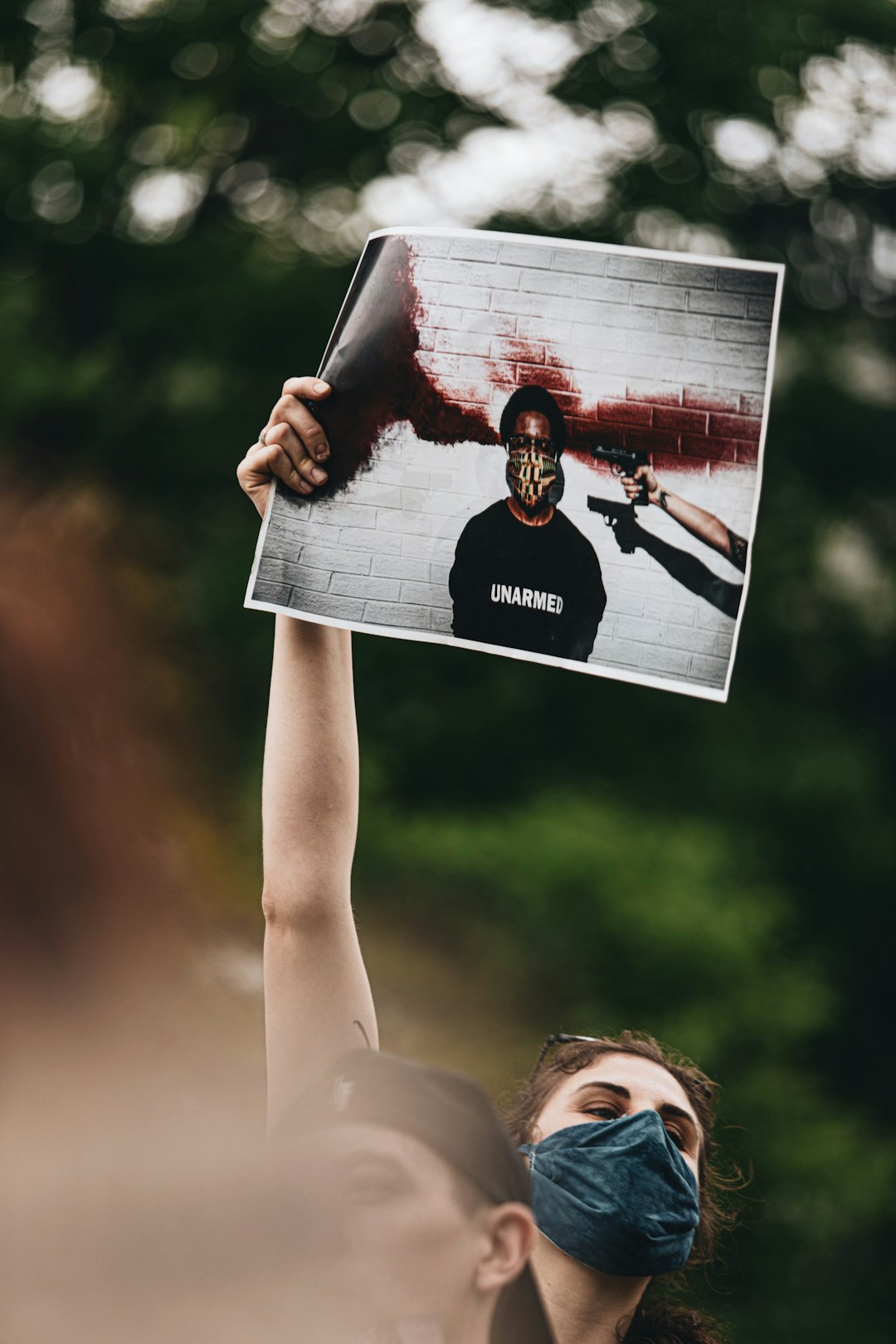 woman holding white and red vinyl record